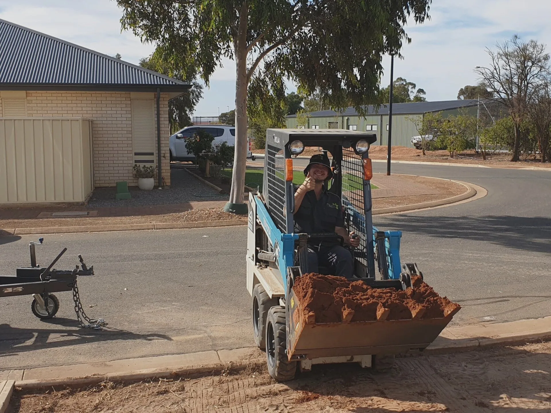 CTK mini loader at work during a landscaping project