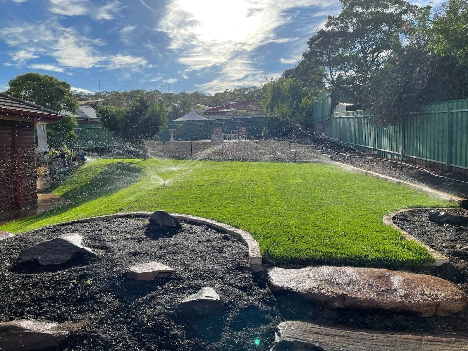 Lush real-turf lawn with pop-up sprinklers running, Northern Adelaide