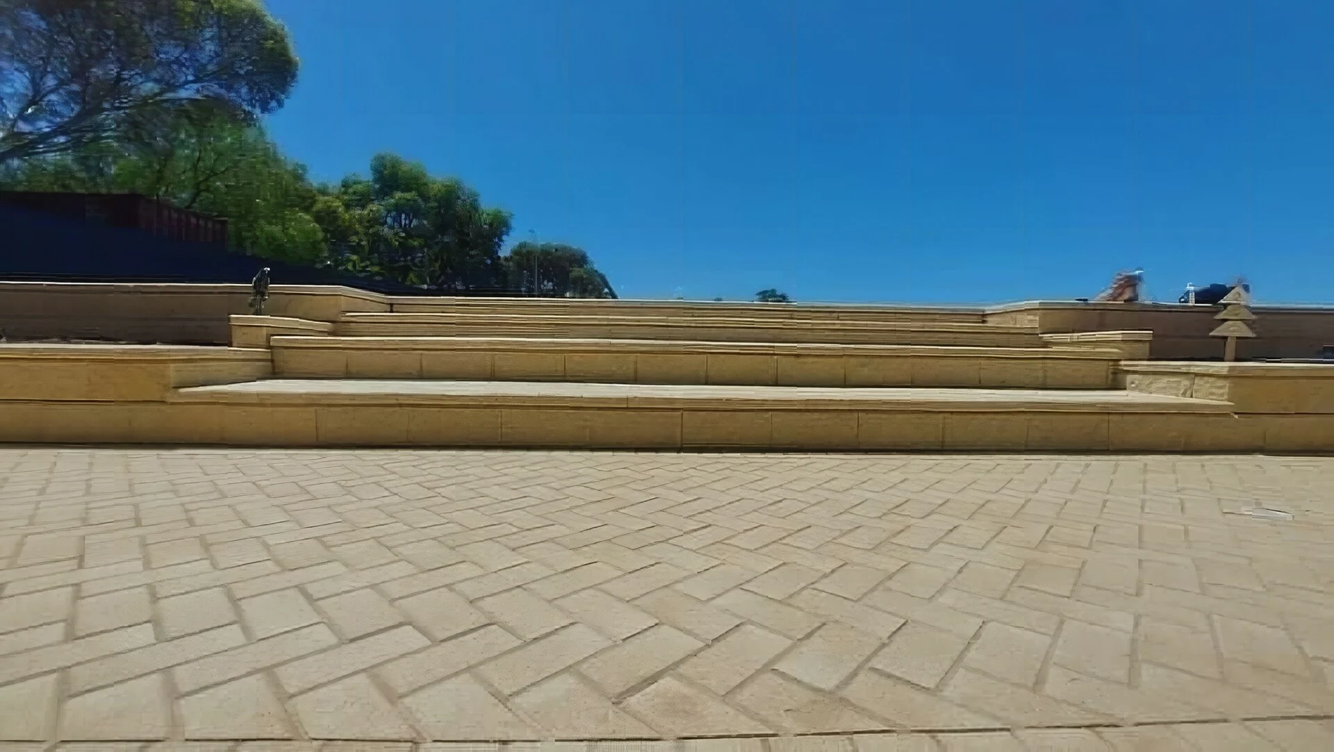 Herringbone-pattern sandstone paving, entertaining area